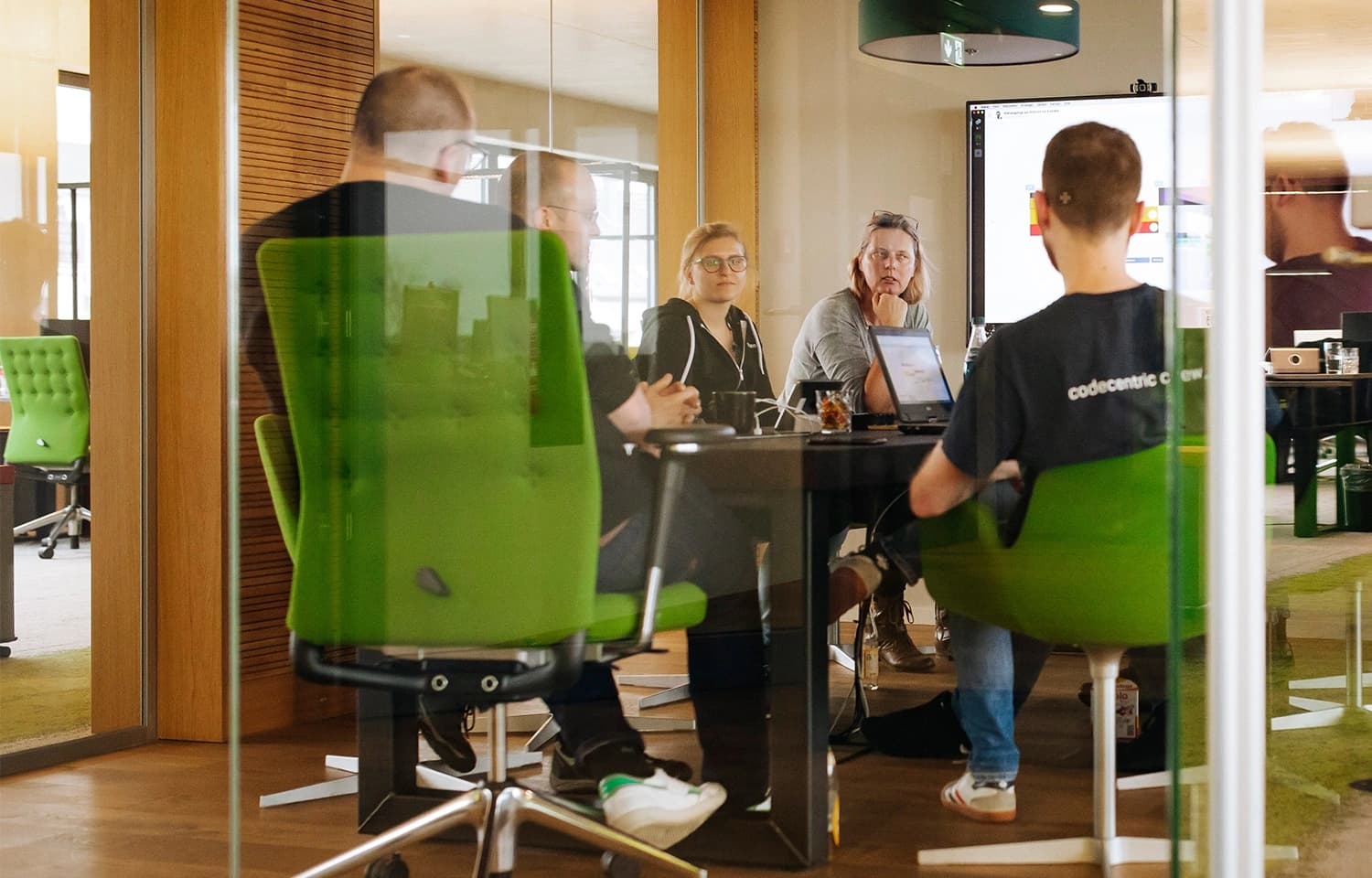 A project discussion meeting with whiteboard and notebook